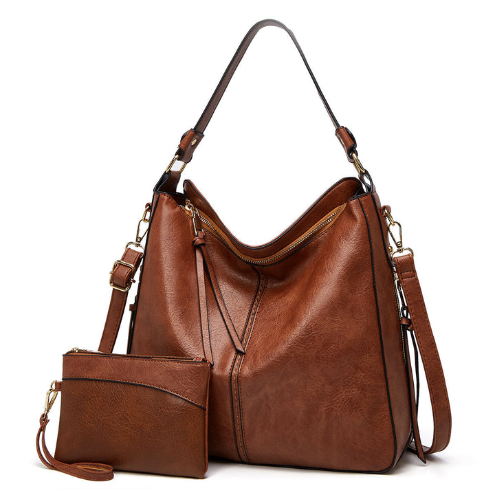 ERIKA ELEGANT LEATHER BAG WITH LARGE CAPACITY AND SIDE POCKETS