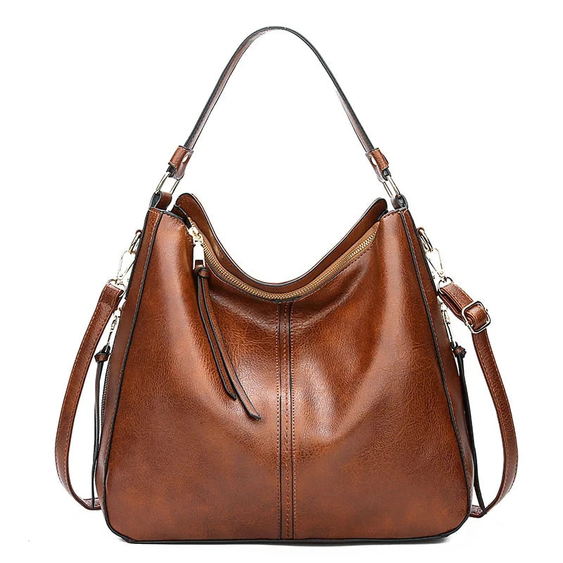 ERIKA ELEGANT LEATHER BAG WITH LARGE CAPACITY AND SIDE POCKETS