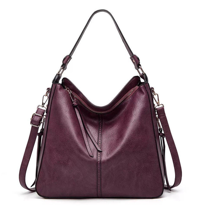 ERIKA ELEGANT LEATHER BAG WITH LARGE CAPACITY AND SIDE POCKETS